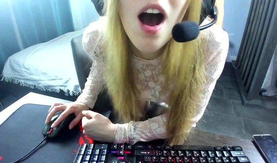 Russian blonde in home sex playing a computer game...
